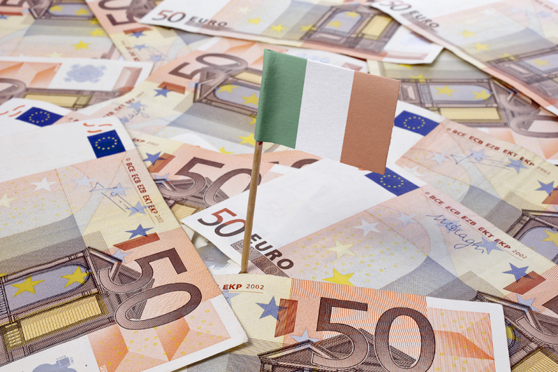 flag of Ireland sticking in european banknotes