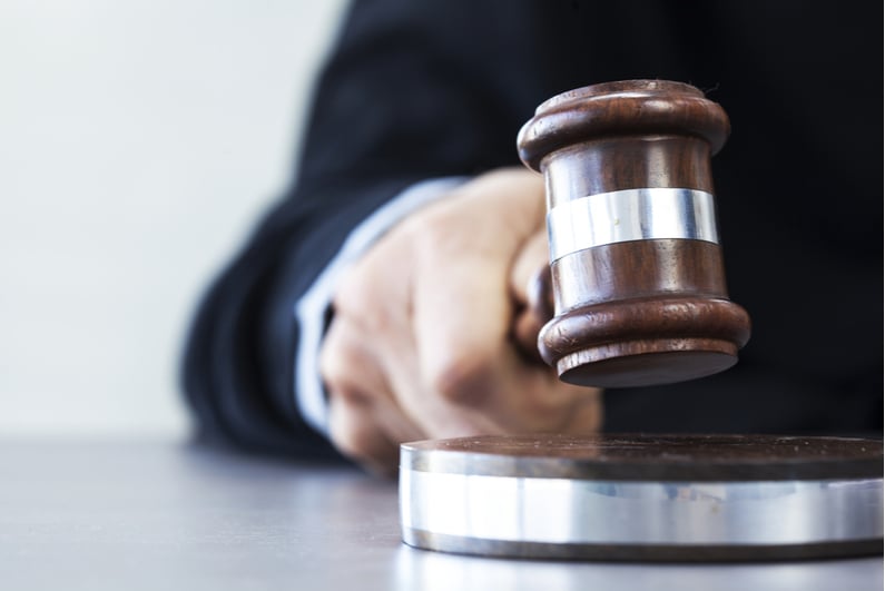 Closeup of a judge holding a gavel